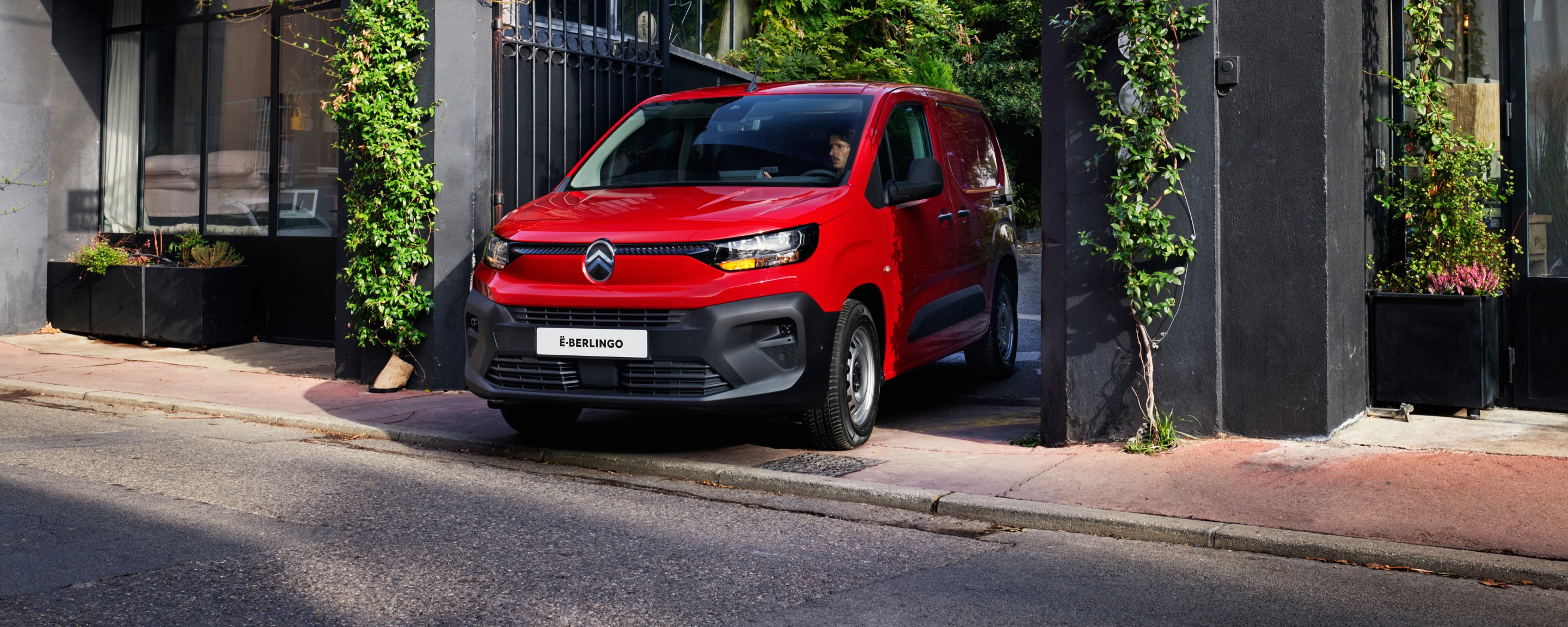 Man charging his red new ë-Berlingo Van