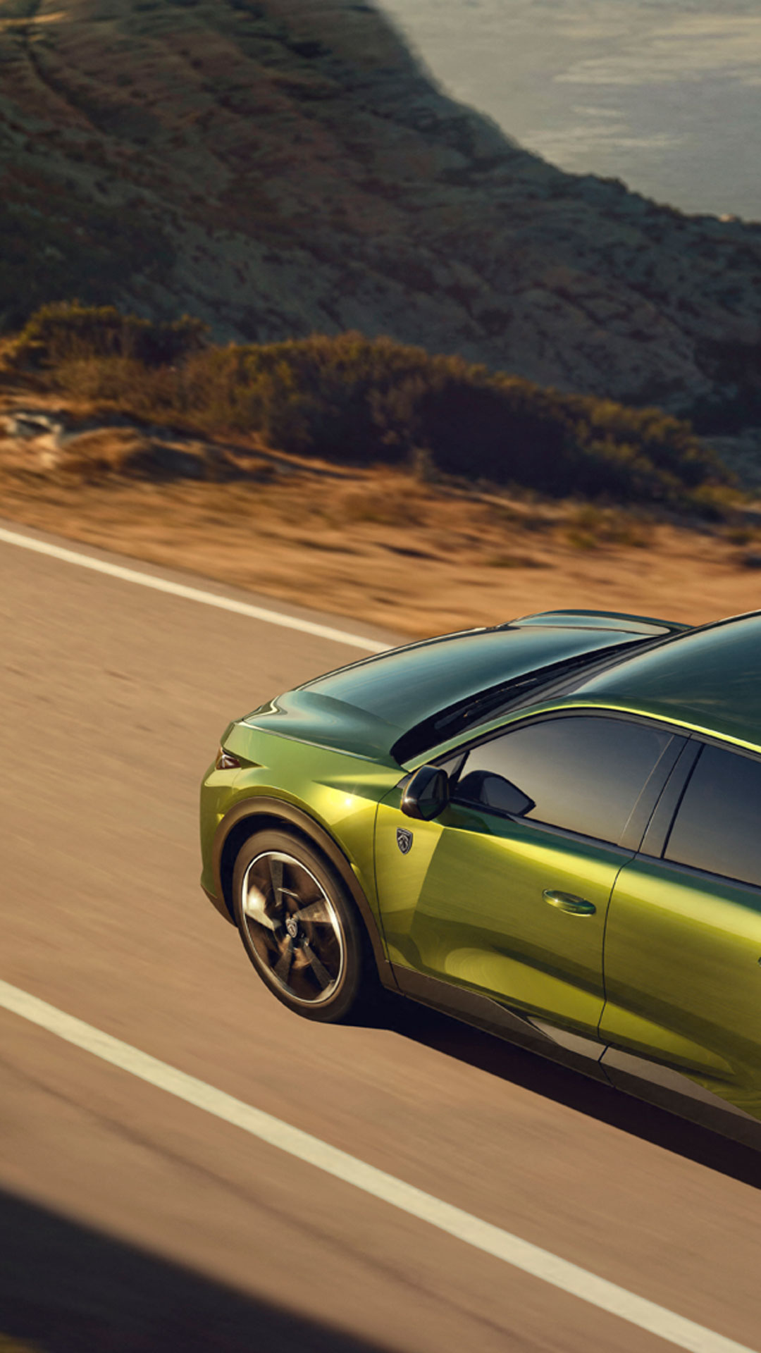 PEUGEOT E-408 on a mountain road